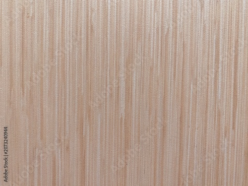 Elegant beige striped wallpaper texture with subtle vertical lines and decorative interior wall pattern background.