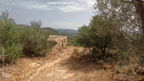 POV Walk Past the Ruins of a Historic Watchtower on the Mallorca Coastline, Spain