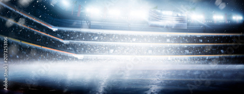 Professional hockey stadium. Ice. Hockey stadium view. Rink. Professional sports background for advertisement with lights, fans and flags. Big sport