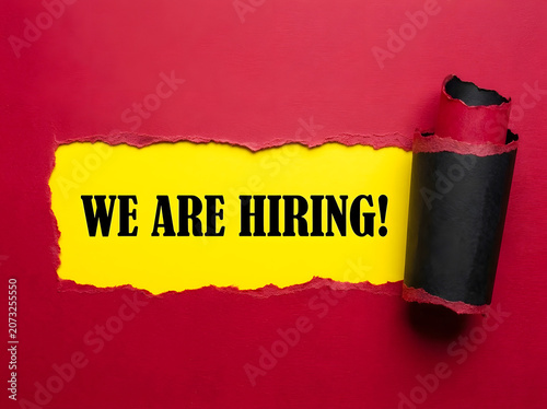 We Are Hiring Message Revealed Through Torn Red Paper For Recruitment Career Opportunity And Human Resources Concept
