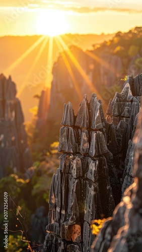 Dramatic sunset illuminating sharp rock formations with golden light