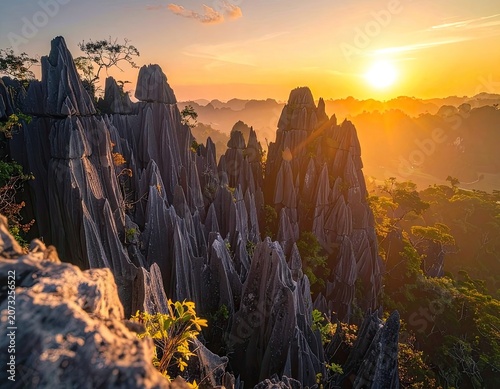 Jagged limestone karsts at sunrise, bathed in golden light.