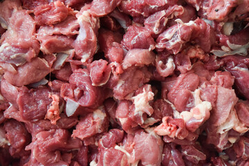 piles of raw and fresh lamb or goat meat obtained during Eid al-Adha in Indonesia.