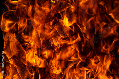 Foto Fire burns on black background