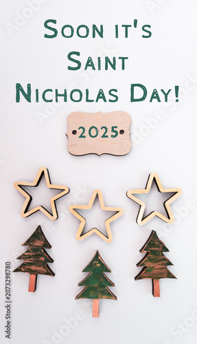 Decorative wooden stars and trees with text announcing Saint Nicholas Day 2025, creating a festive atmosphere for holiday celebrations and seasonal joy