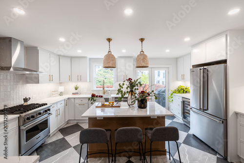 Modern White Kitchen with Marble Island, Gray Bar Stools and Checkered Floor