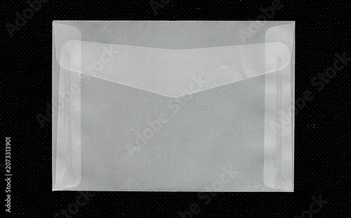 Obraz na plátně Closed translucent vellum envelope isolated on black background