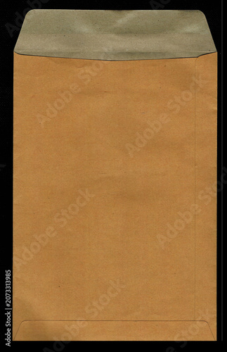 Open brown kraft paper envelope isolated on black background