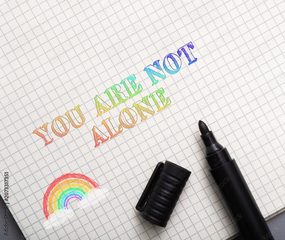 Fototapeta premium Rainbow Text Message of Support on Grid Paper