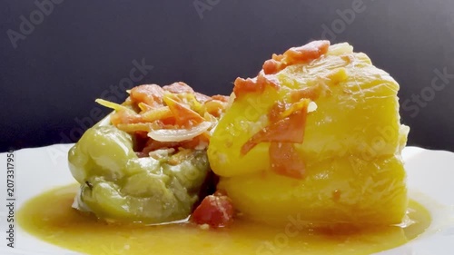 Bell peppers stuffed with meat and rice, stewed in tomato sauce. Delicious and healthy home cooking.