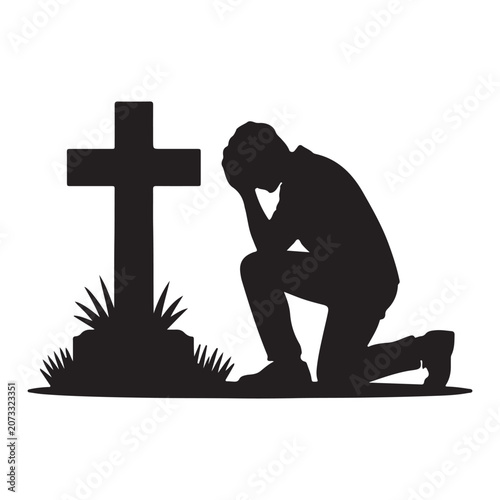 Fotografía Silhouette of a man kneeling in grief beside a grave cross in cemetery
