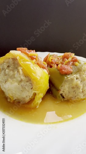 Bell peppers stuffed with meat and rice, stewed in tomato sauce. Delicious and healthy home cooking.
