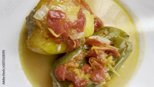 Bell peppers stuffed with meat and rice, stewed in tomato sauce. Delicious and healthy home cooking.