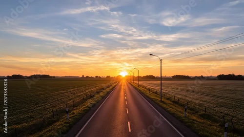 Rural Road Sunrise Sunset Time Lapse with Dramatic Sky and Golden Light.