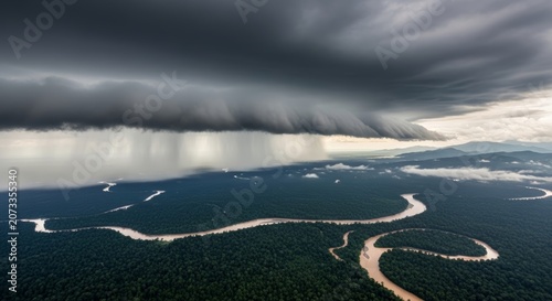 Powerful rainstorm deluge over winding Amazon river and dense rainforest, captured aerially, ideal for illustrating climate dynamics and force of natural ecosystems