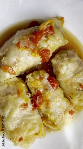 Cabbage rolls stewed in tomato sauce, cabbage leaves stuffed with meat and rice. Delicious and healthy home cooking.