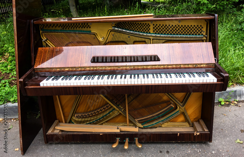 Old retro piano, musical instruments, vintage piano outdoors