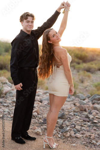 Dressed up couple in desert landscape