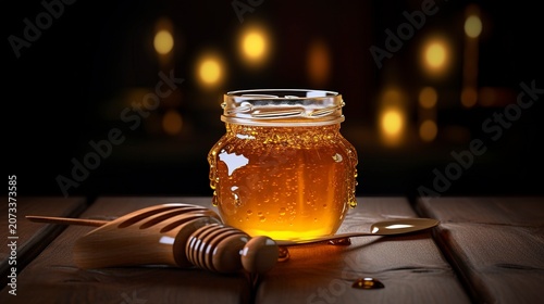 A photo of honey in a jar on a dark rustic table.