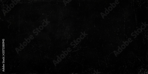 Photos Scratched dark surface with white marks and scuffs on rough textured material