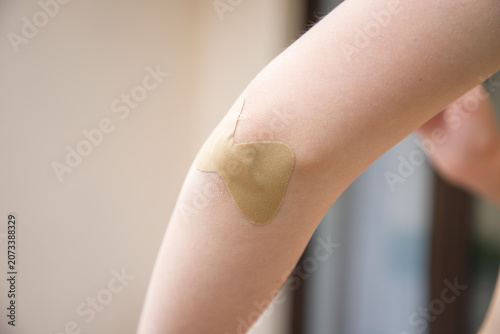Obraz na płótnie Close-up of a woman with adhesive plaster on her arm.