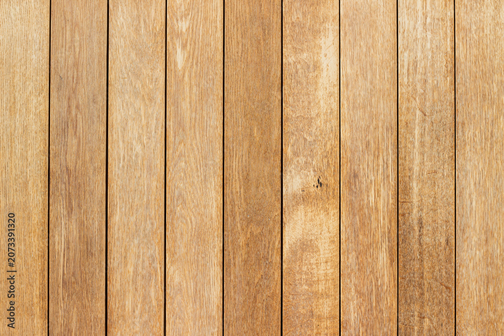 Obraz premium Close-up view of wooden planks arranged in parallel, showcasing natural grain patterns and textures, suitable for backgrounds or design elements in various projects
