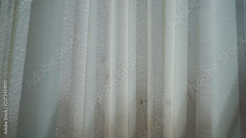 Abstract linear pattern of white styrofoam insulation sheets