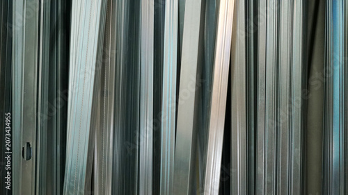 Abstract linear pattern of galvanized steel studs and tracks