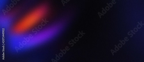 Abstract bokeh lights with vibrant blue and orange hues against a dark background