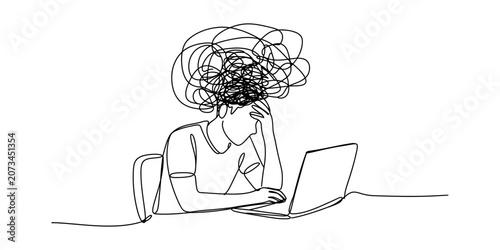 Photos Stressed person sitting at a laptop with a messy scribble cloud above their head