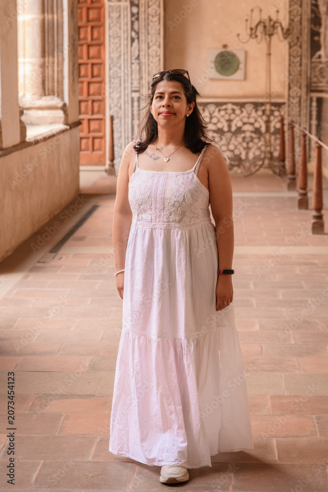 Obraz premium Portrait of a Woman in White Dress Inside Malinalco Convent Corridor