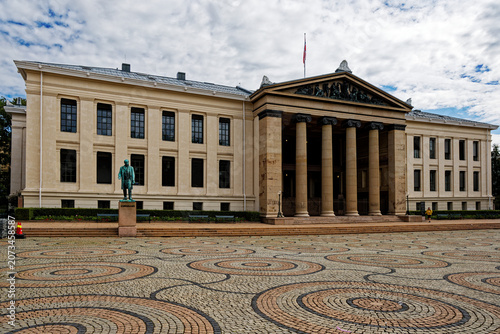 University of Oslo's Main Building with Schweigaard Statue and Unique Cobblestone Plaza