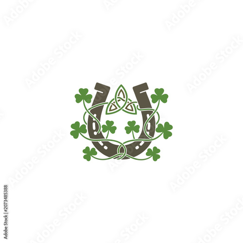 A brown horseshoe decorated with green leaves on white background