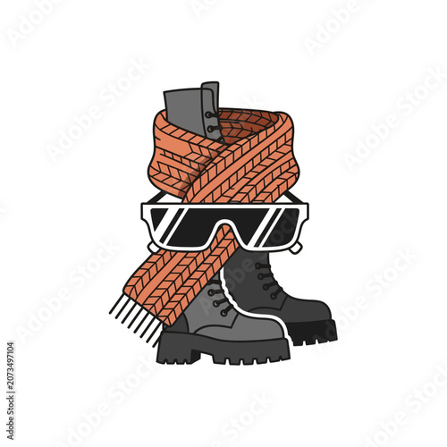 A pair of winter boots with a warm scarf and sunglasses