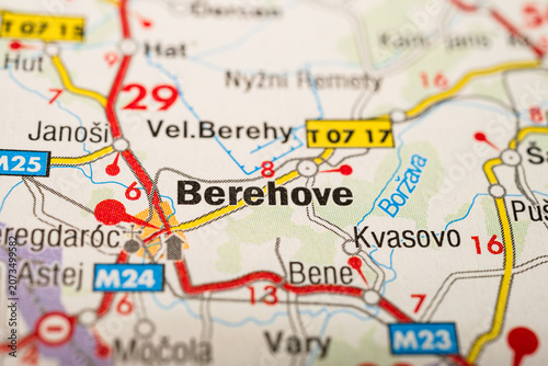 Macro photograph of printed road map highlighting Berehove and nearby towns in Ukraine.