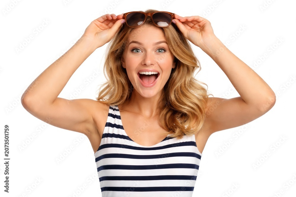 Fototapeta premium Excited woman holding sunglasses smiling
