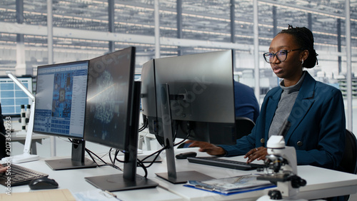 Cuadro en lienzo Senior manager and woman using AI to optimize microchip production in factory RD workspace, asian team leader and worker in office using AI to improve semiconductors, camera A