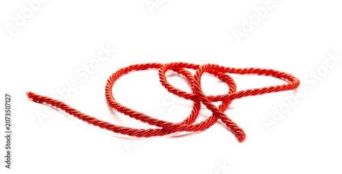 Фотография Red string, rope isolated on white background, side view, design element