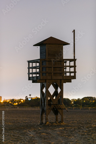 Coast guard watchtower illuminated by bright moonlight at night