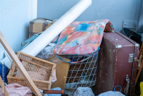 Photos Cluttered balcony filled suitcases, piles clothes household mess creating chaoti