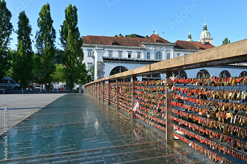Vászonkép Love Locks on Butchers' Bridge over Ljubljanica River in Ljubljana, Slovenia on clear sunny summer morning