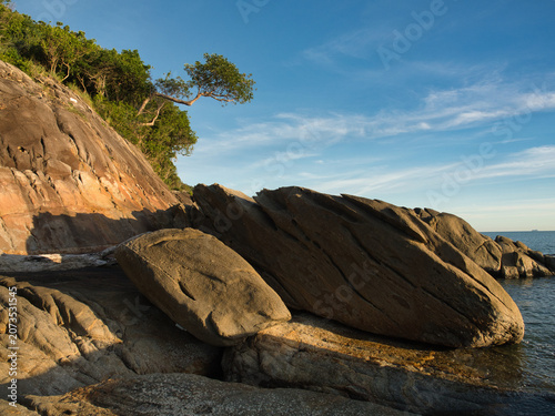 Canvas Print Large weathered granite rock formations with distinct slabs highlighted by lush vegetation clinging to the cliffs are a tourist attraction in khanom district nakhon si thammarat province