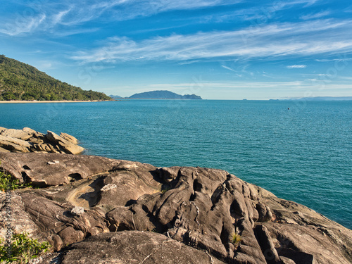 Obraz na plátně Large weathered granite rock formations with distinct slabs highlighted by lush vegetation clinging to the cliffs are a tourist attraction in khanom district nakhon si thammarat province