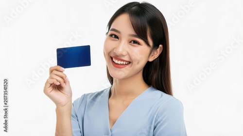Smiling Woman with Blue Card: A young Asian woman with a bright smile and dimples holds up a blank blue card, representing financial freedom and easy payment.