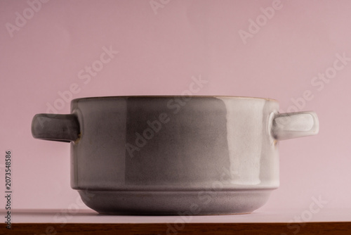 Photos ceramic grey pot on a pink background