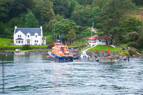 Obraz na plátně Orange Lifeboat Moored at Port Askaig Harbour on the Isle of Islay