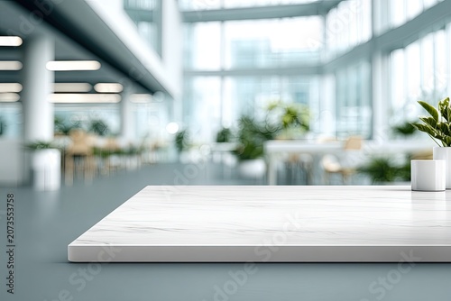 A pristine white marble tabletop extends into a blurred, modern interior space filled with greenery and light.