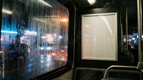 Rainy Night Commute Through City Lights Seen Through a Streaked Bus Window