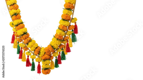 Vibrant yellow flower garland with colorful tassels on white background