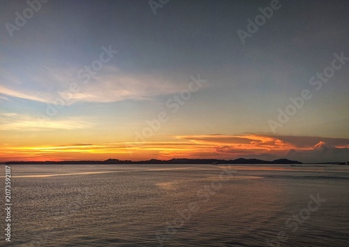 Peaceful Ocean Waves at Sunrise with Gentle Ripples and Calm Coastal Horizon